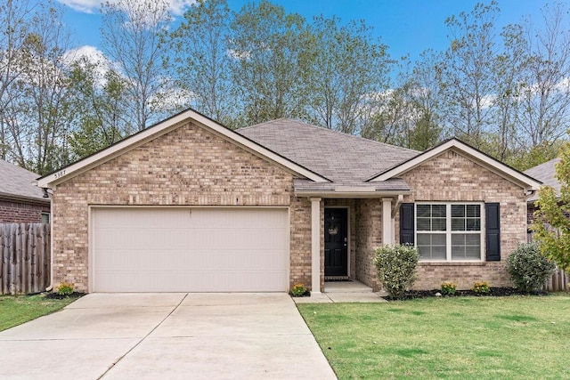 view of front of property with a garage and a front lawn