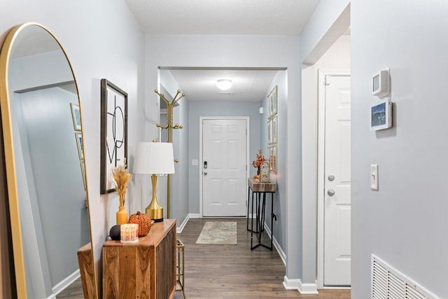 corridor with dark hardwood / wood-style floors