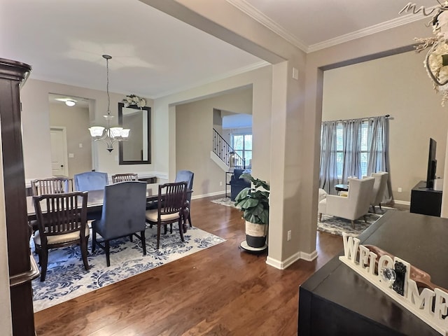 dining space with a chandelier, dark hardwood / wood-style floors, and ornamental molding