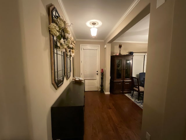 hall featuring dark hardwood / wood-style floors and ornamental molding