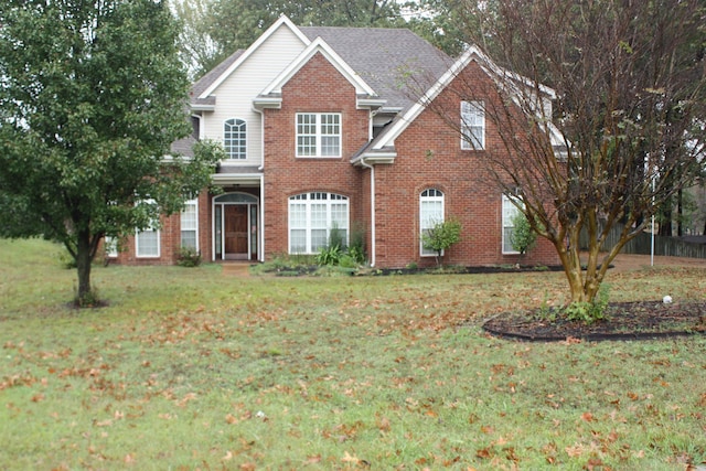 front facade with a front yard