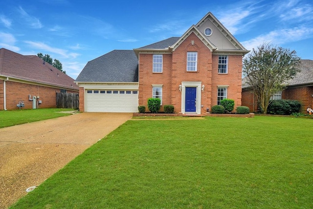 view of front of house with a garage and a front yard