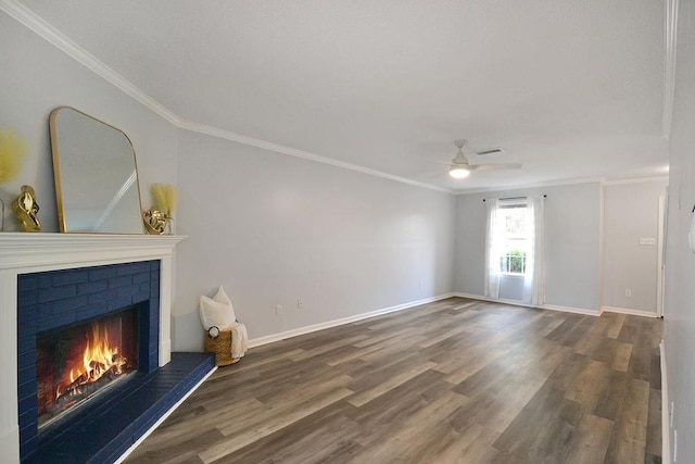 unfurnished living room with hardwood / wood-style flooring, crown molding, and a fireplace