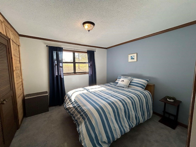 carpeted bedroom with a textured ceiling and ornamental molding