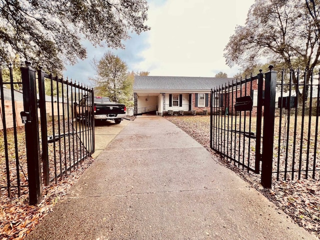 view of gate featuring a garage