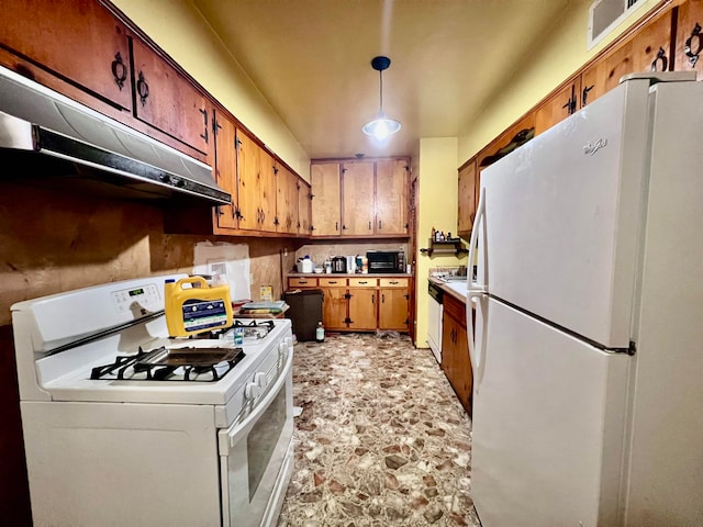 kitchen with hanging light fixtures and white appliances