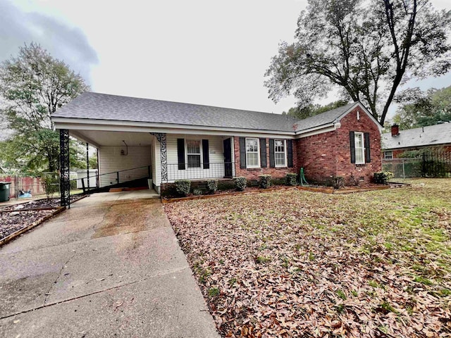 single story home featuring a carport