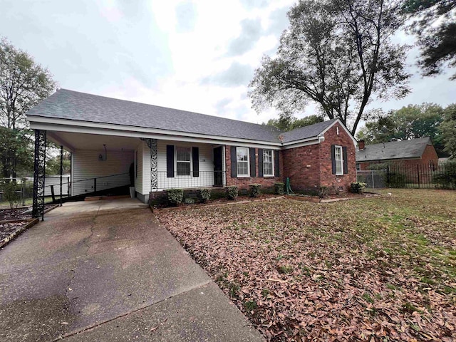 single story home featuring a carport