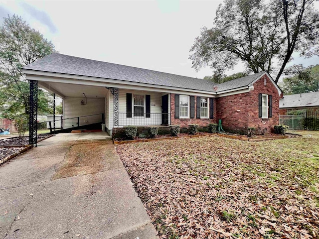 single story home featuring a carport