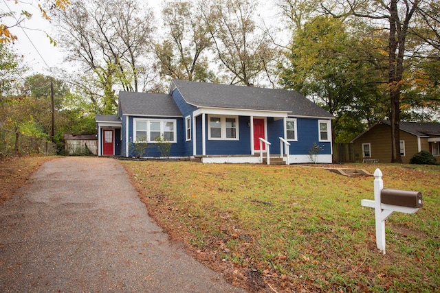 ranch-style house with a front yard