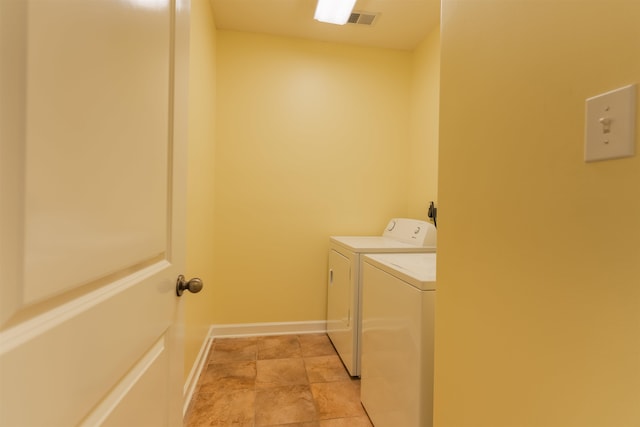 laundry room with washing machine and dryer