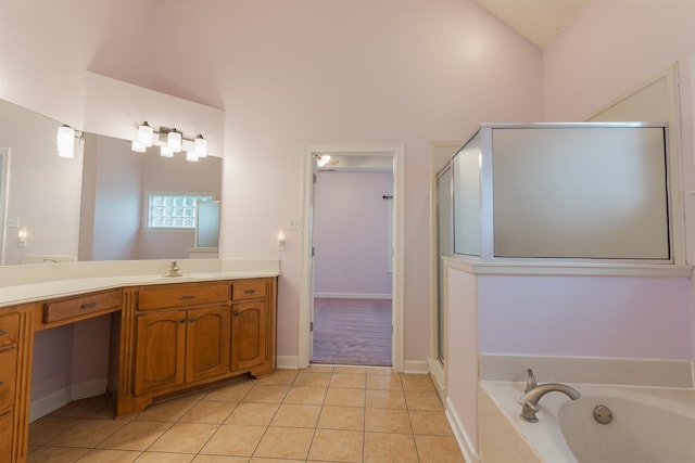 bathroom featuring vanity, tile patterned flooring, plus walk in shower, and vaulted ceiling