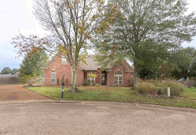 view of front of property with a front lawn