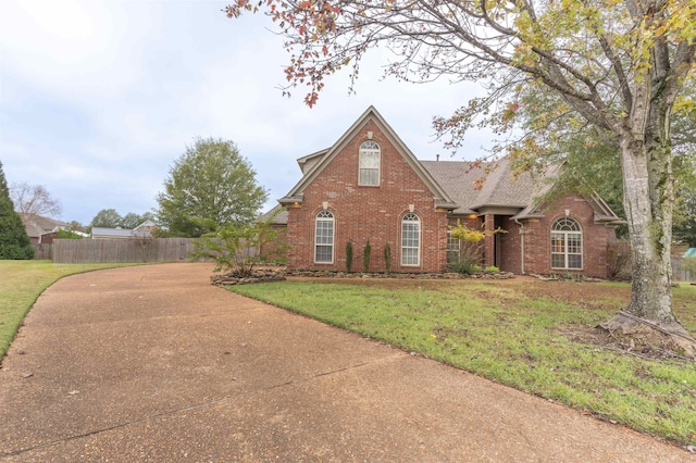 front facade with a front yard