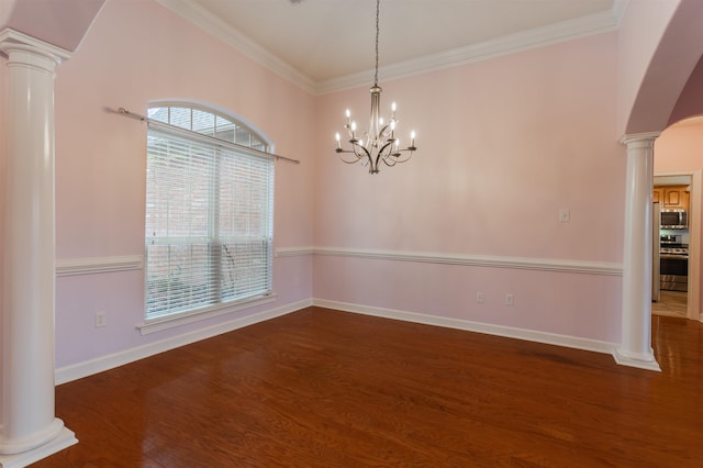 unfurnished dining area featuring decorative columns, dark hardwood / wood-style floors, a chandelier, and ornamental molding