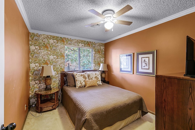 bedroom featuring a textured ceiling, light colored carpet, ceiling fan, and crown molding