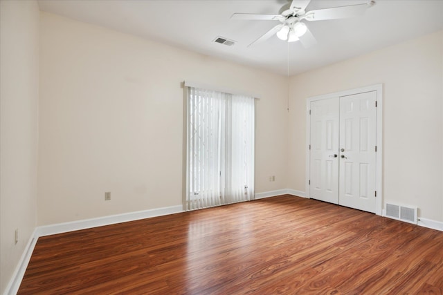 unfurnished bedroom featuring hardwood / wood-style floors and ceiling fan