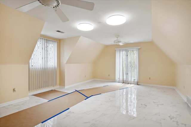 bonus room featuring ceiling fan and vaulted ceiling