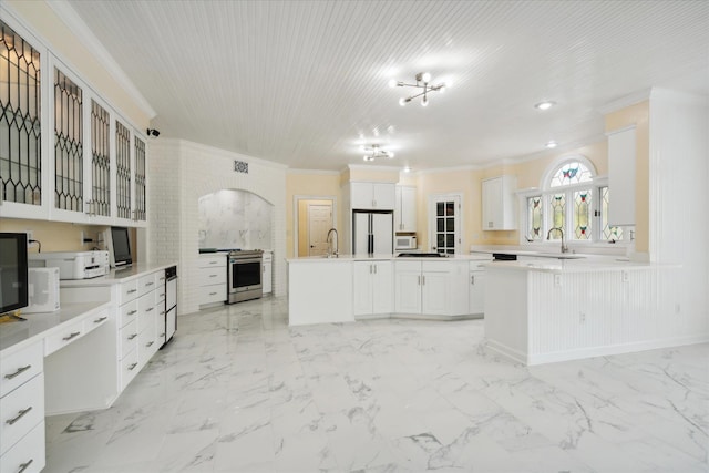 kitchen with crown molding, white cabinetry, white appliances, sink, and kitchen peninsula