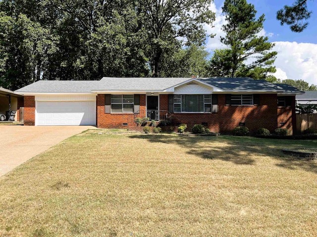 ranch-style home featuring a garage and a front yard