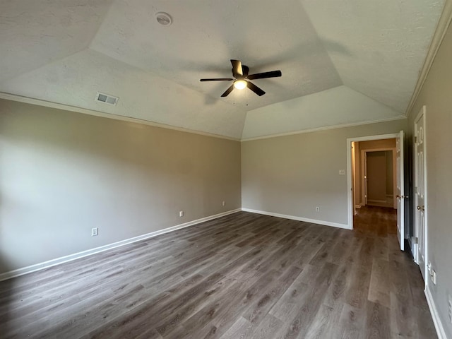 spare room with lofted ceiling, hardwood / wood-style flooring, ceiling fan, and ornamental molding