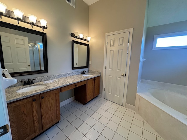 bathroom with tile patterned flooring, vanity, and independent shower and bath