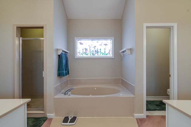 full bathroom featuring independent shower and bath, tile patterned floors, vanity, and toilet