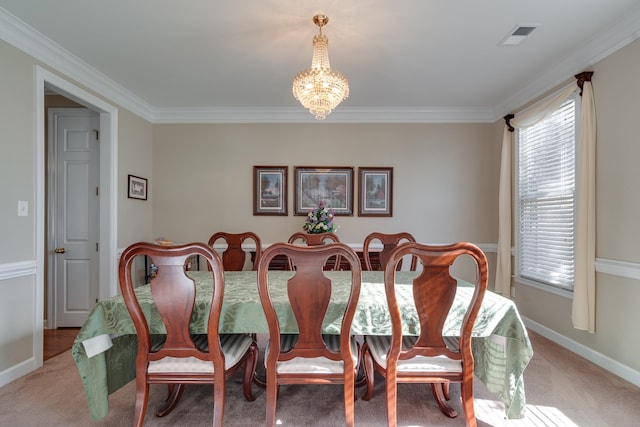 dining area with carpet flooring, an inviting chandelier, and crown molding