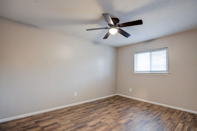 unfurnished room featuring ceiling fan, a textured ceiling, and dark hardwood / wood-style floors