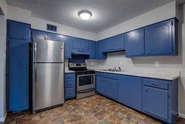 kitchen with a textured ceiling, sink, appliances with stainless steel finishes, and blue cabinets