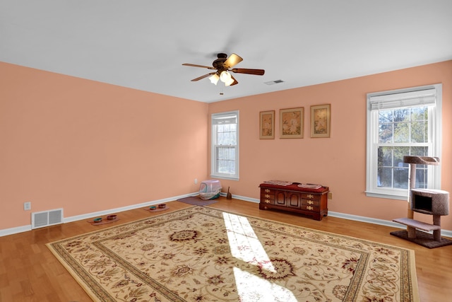 unfurnished room featuring hardwood / wood-style floors and ceiling fan