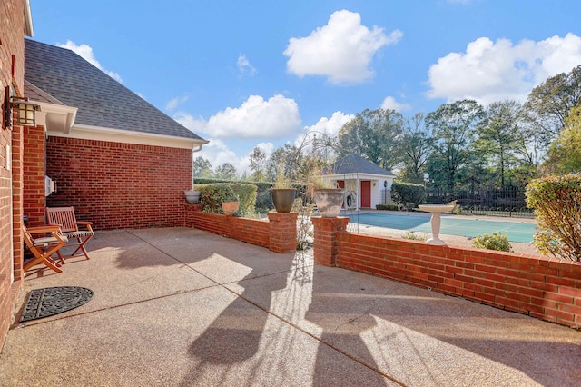 view of patio / terrace featuring an outbuilding