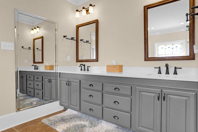 bathroom with vanity, ornamental molding, and tile patterned floors