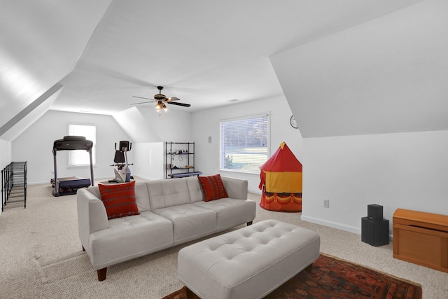 living room with ceiling fan, lofted ceiling, and carpet floors