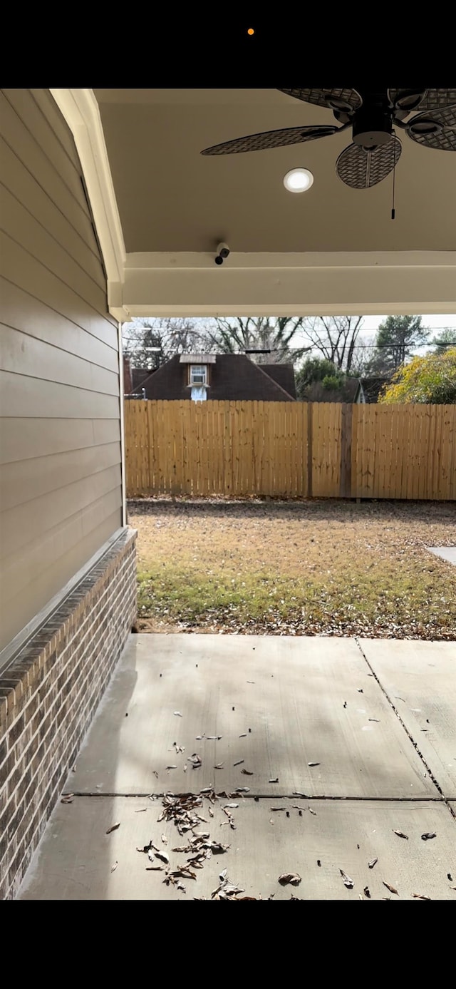 view of patio featuring ceiling fan