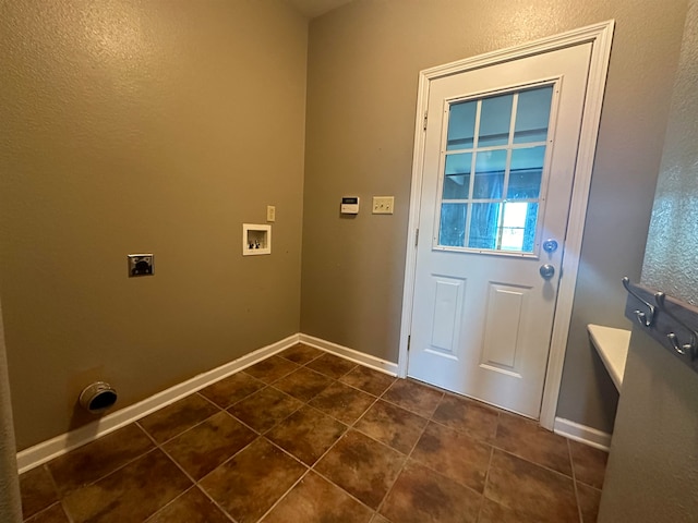 laundry room with washer hookup, electric dryer hookup, and dark tile patterned flooring