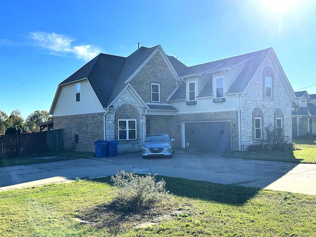 view of front of property featuring a garage and a front yard