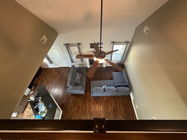 dining room featuring hardwood / wood-style flooring and lofted ceiling