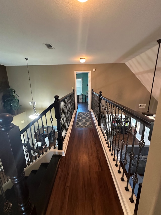 hallway featuring dark wood-type flooring