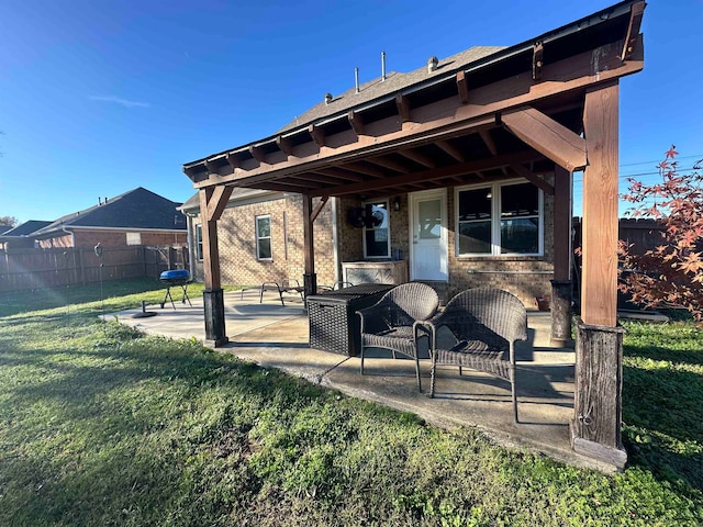 rear view of house with a lawn and a patio area