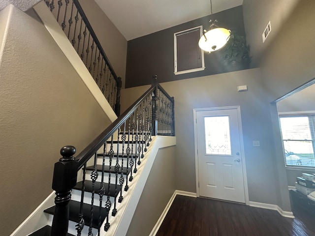 entryway with hardwood / wood-style flooring