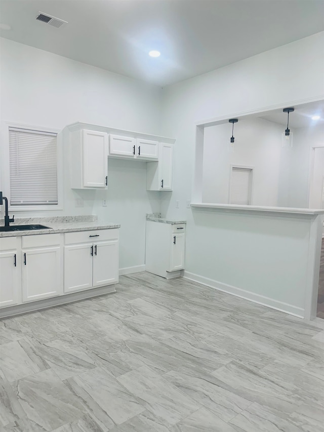 clothes washing area featuring sink