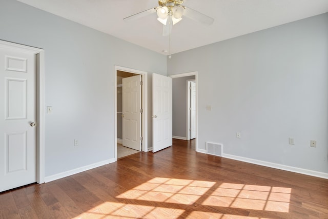 unfurnished bedroom featuring hardwood / wood-style flooring and ceiling fan