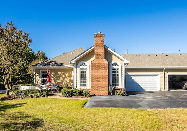 view of front of home featuring a garage and a front lawn