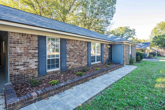 property entrance with a yard