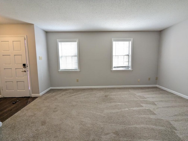 interior space with a textured ceiling and plenty of natural light