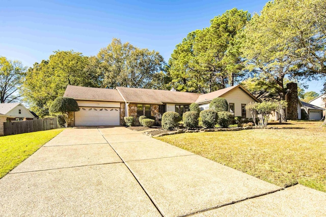 single story home with a garage and a front yard