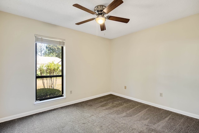 empty room featuring carpet flooring and ceiling fan