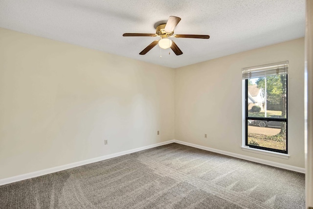 spare room featuring carpet, a textured ceiling, and ceiling fan