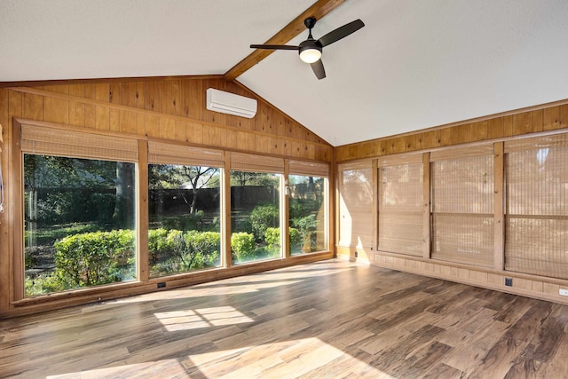 unfurnished sunroom featuring ceiling fan, vaulted ceiling with beams, and a wall mounted AC